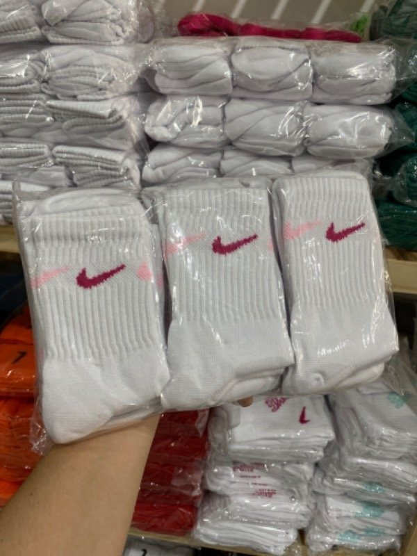 Media 3/4 nike blancas pipas rosa