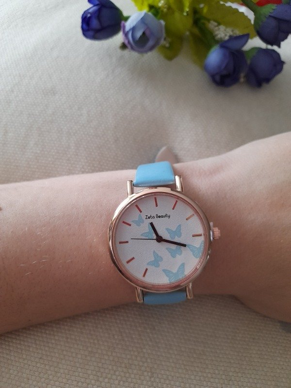 Producto - reloj con celeste mariposas
