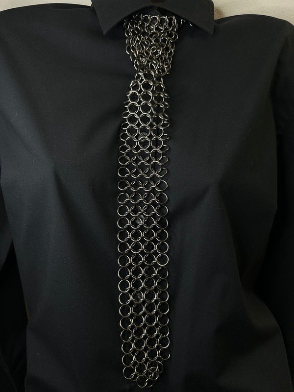 Producto - Cota TIE peltre simple