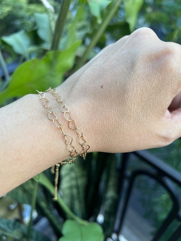 Producto - 2 pulseras corazoncitos acero dorado