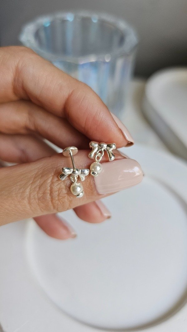 Producto - Abridor moño con perla colgante. Plata