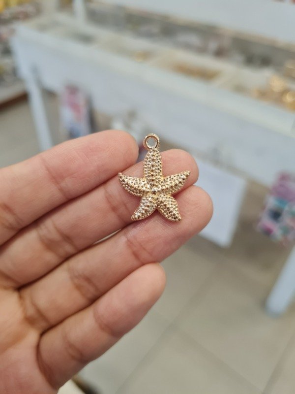 Producto - DIJE DORADO ESTRELLA DE MAR 20MM