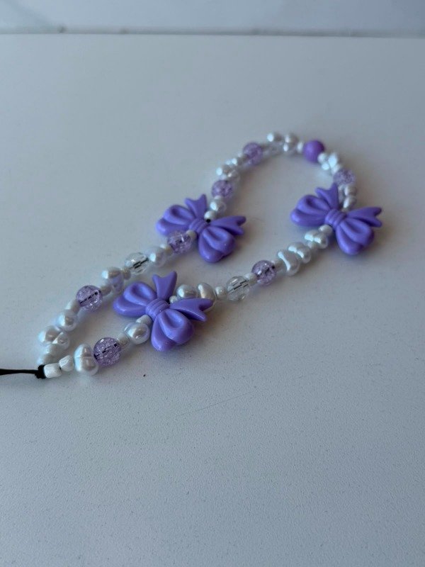 Producto - Strap perlas y moños lila