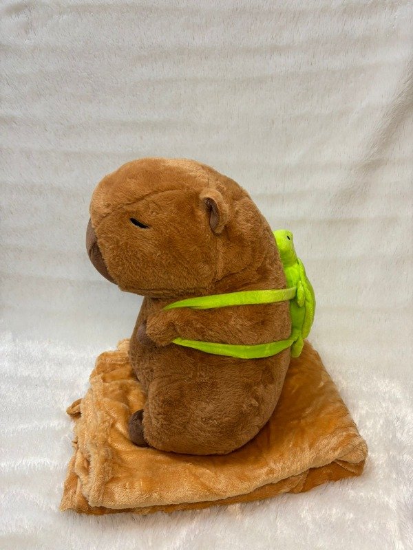Producto - Peluche capibara con mochila tortuga 3 en 1