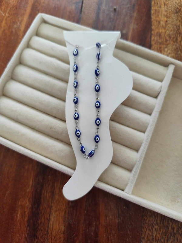 Producto - Tobillera ojitos. Acero quirúrgico.