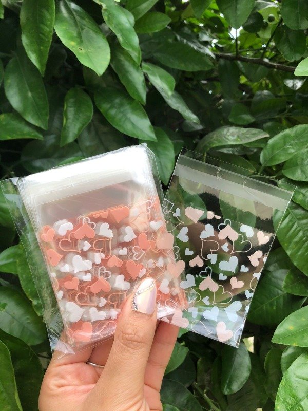 Producto - Bolsitas con adhesivo corazones blancos y rosadosdispersas x 25
