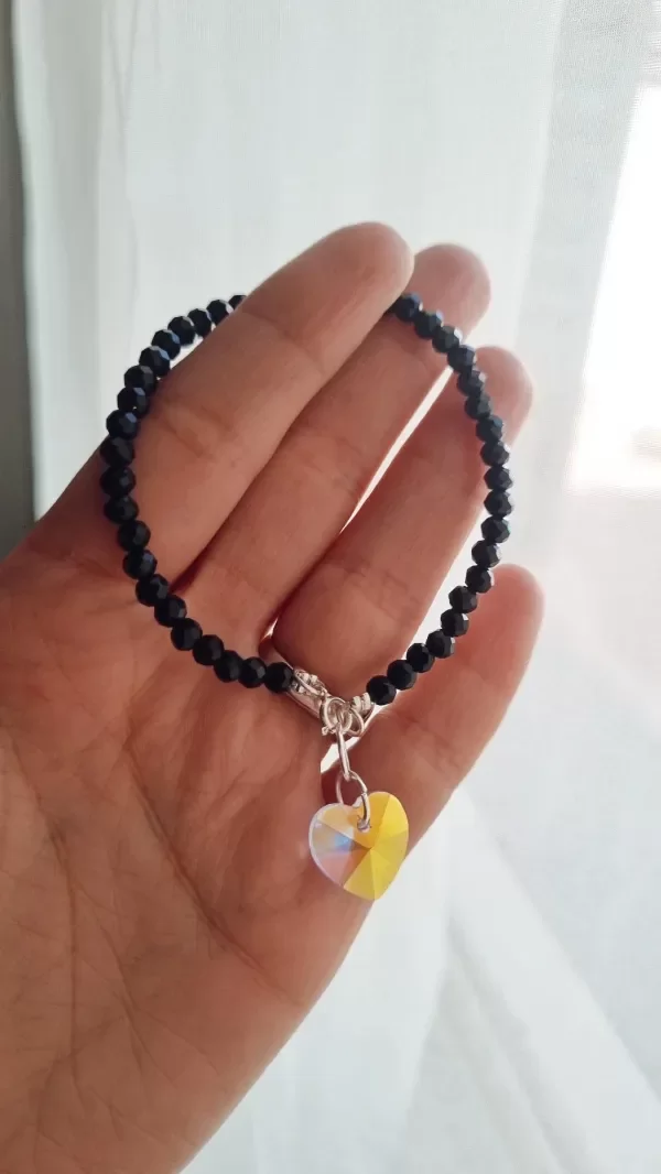 Producto - Pulsera negra con corazon tornasol plata 925