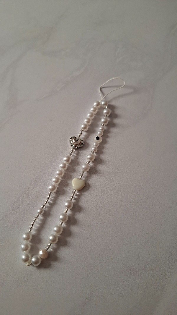 Producto - Strap Phone perlado beige