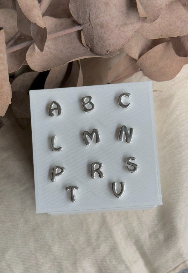 Producto - Dije pasante letras