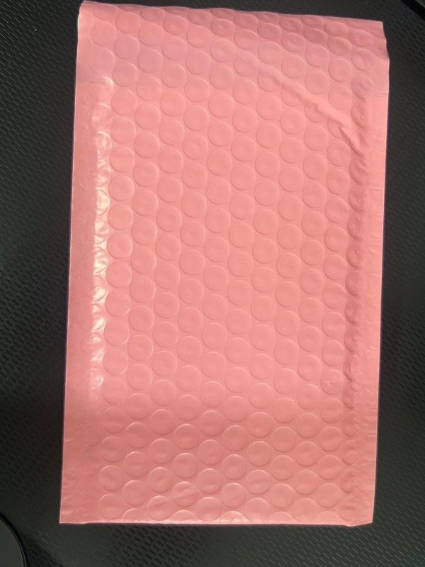 Producto - 50 sobres burbujitas salmon  pegamento y sticker de regalo 15 x 13 cm