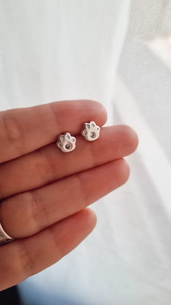 Producto - Aros pasantes huellitas strass blanco plata 925