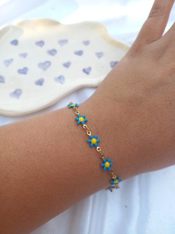 Producto - pulsera margaritas golden (celeste)
