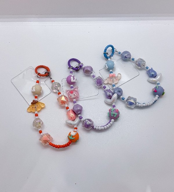 Producto - Llaveros Sanrio flor pulsera para celular surtido (900086)