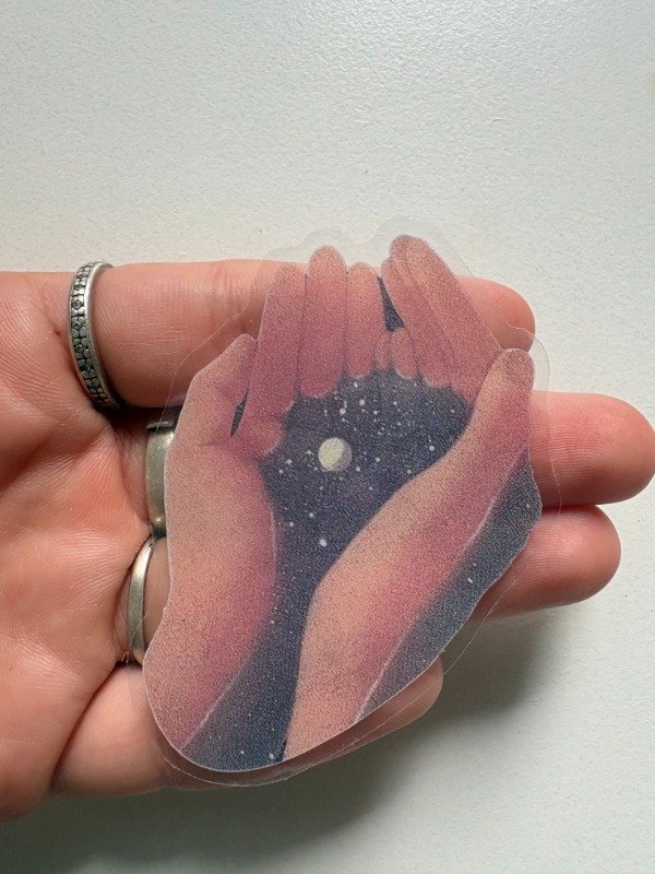 Producto - sticker el universo en las manos