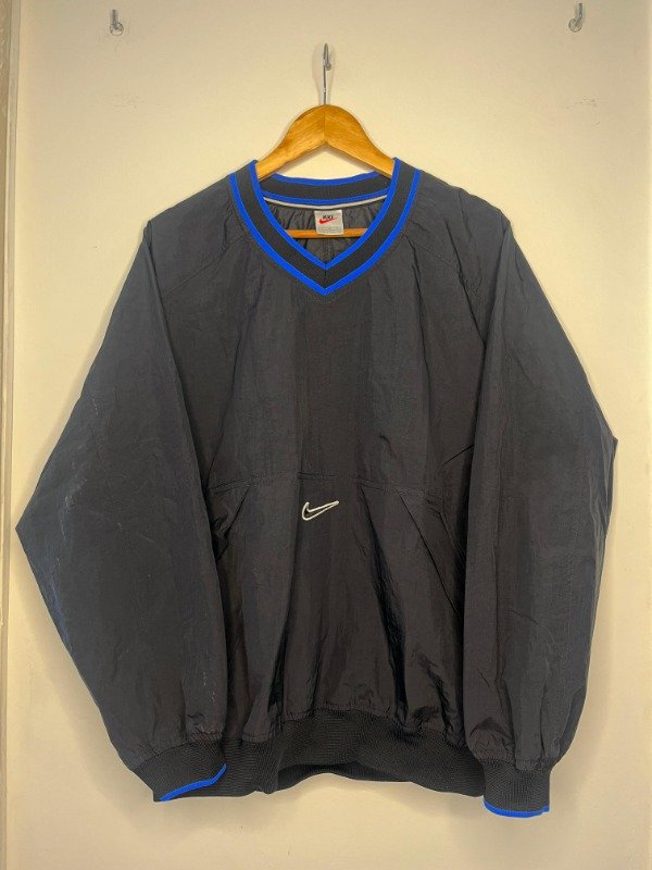 Producto - ANORAK NIKE ROMPEVIENTO NEGRO