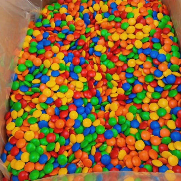 Producto - LENTEJAS DE CHOCOLATE MULTICOLOR FRACCIONADA POR KILO