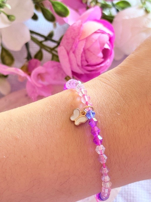 Producto - Pulsera Cristales tonos rosas y dije mariposa