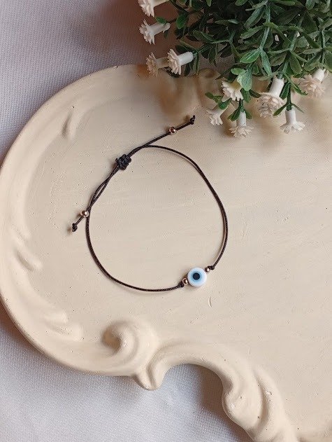 Producto - Pulsera negra ojo turco blanco - 1