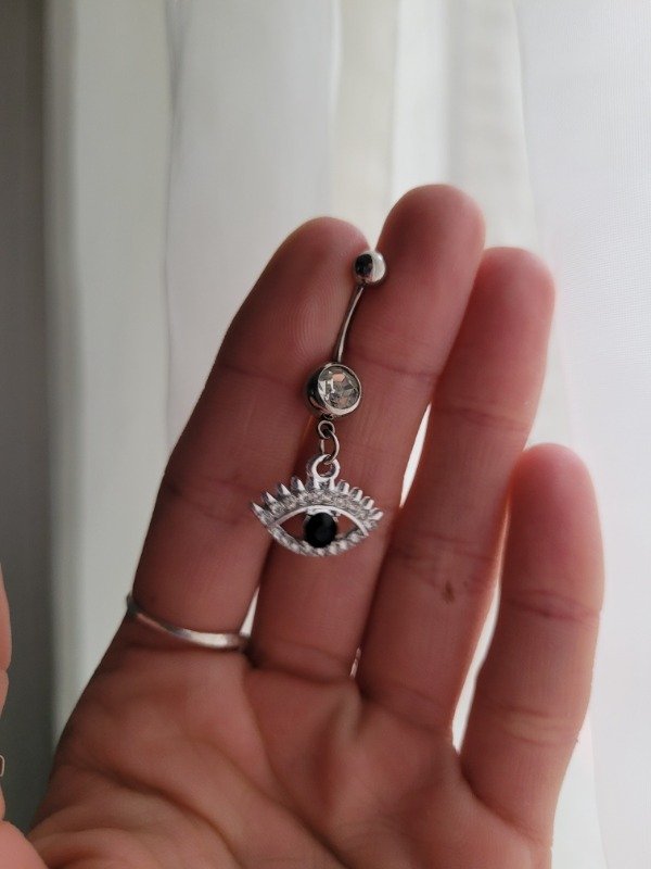 Producto - Piercing ombligo de acero + dije ojito