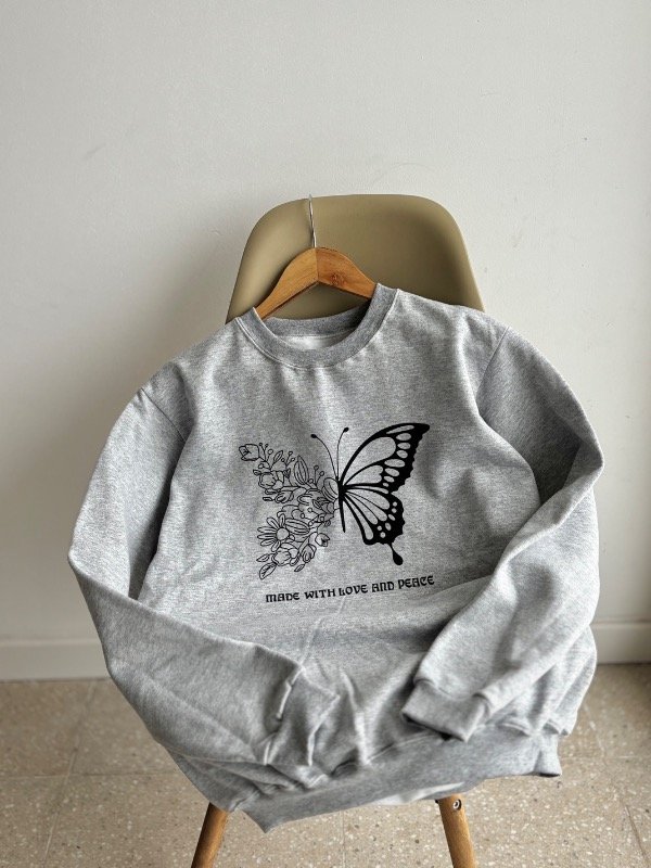Buzo algodón oversize mariposa frisado
