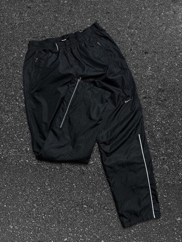 Producto - PANT NIKE ROMPEVIENTOS REFLEX STRIPES OG