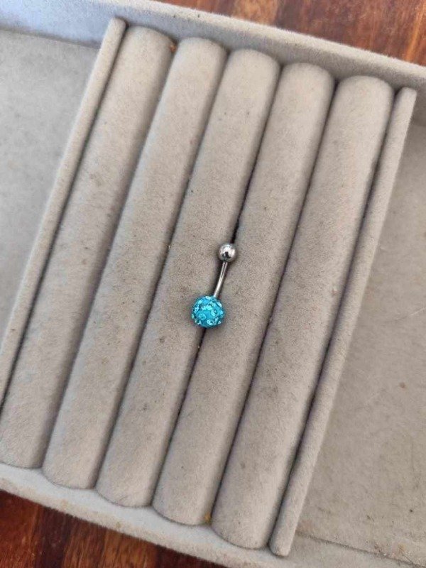 Producto - Piercing ombligo bola de fuego turquesa. Acero quirúrgico