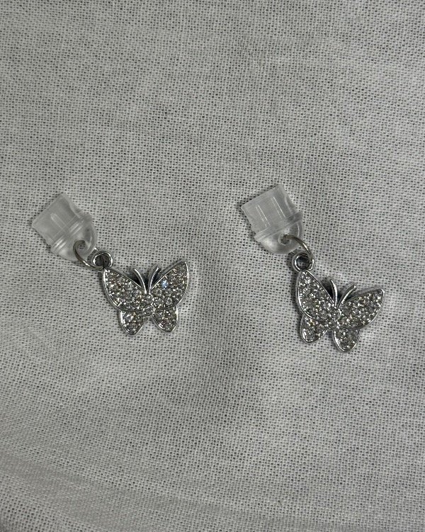 Producto - Anti polvo Mariposa Plateada