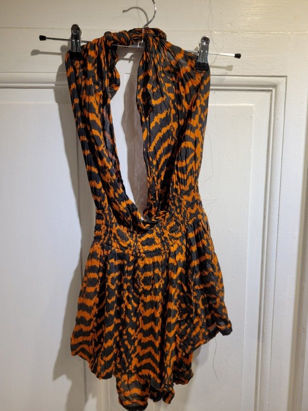 Producto - Mono LUNA MAY negro y naranja Talle XS - PRECIO: 24X