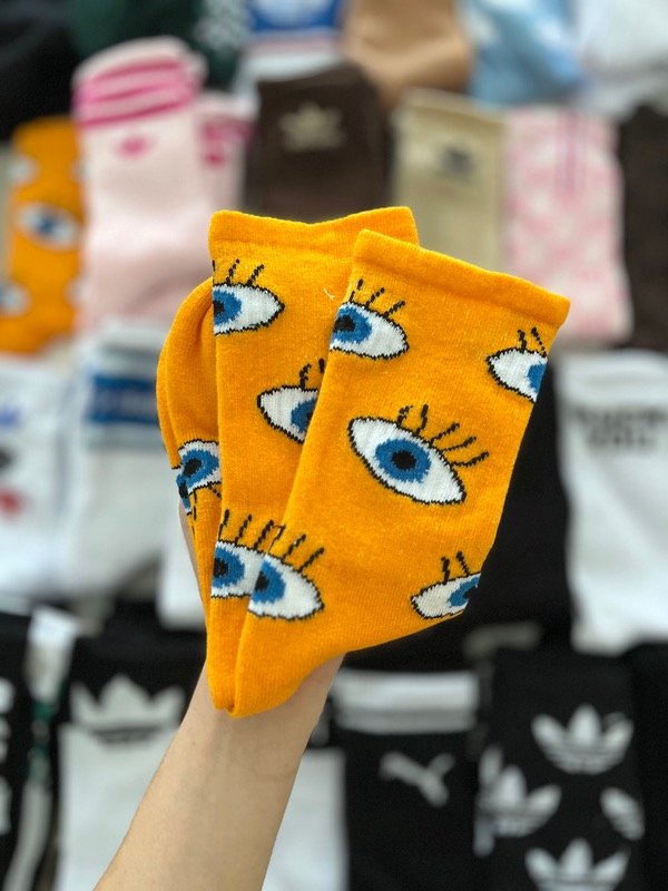 Producto - OJITOS FONDO NARANJA