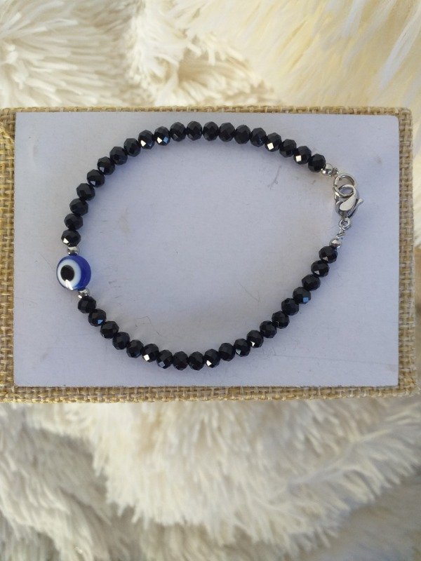 Producto - AQP0107 Cristal Negra Bolita con Ojito Azul