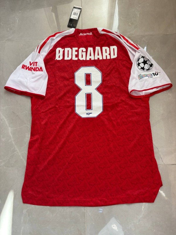 Producto - Arsenal FC Local  25/26 Version Jugador 8 Odegaard Champions League