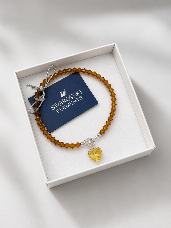 Producto - Pulsera cristal Swarovski color marrón con dije corazón