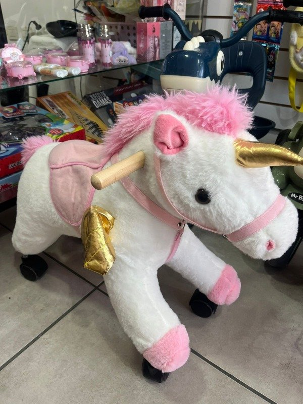 Producto - unicornio con rueditas musical