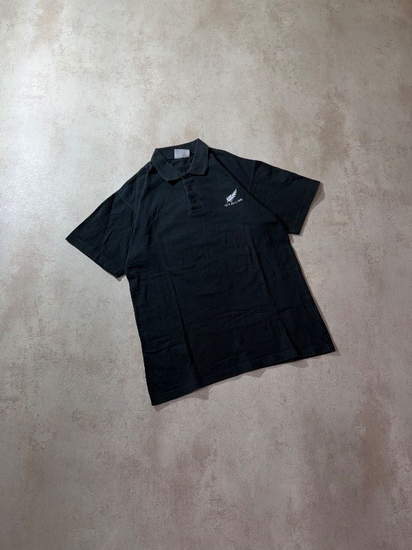 Producto - Chomba Champions Nueva Zelanda T.L