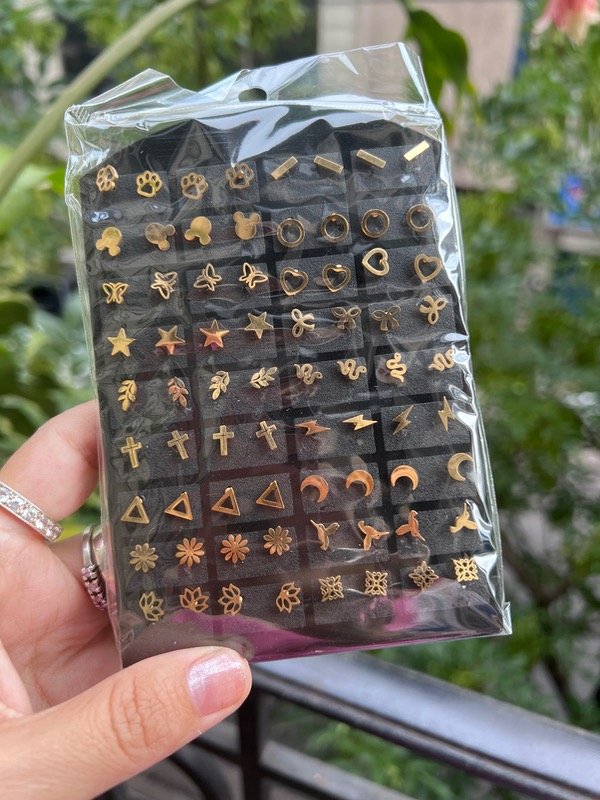 Producto - Blister de aros de acero dorado con nudo