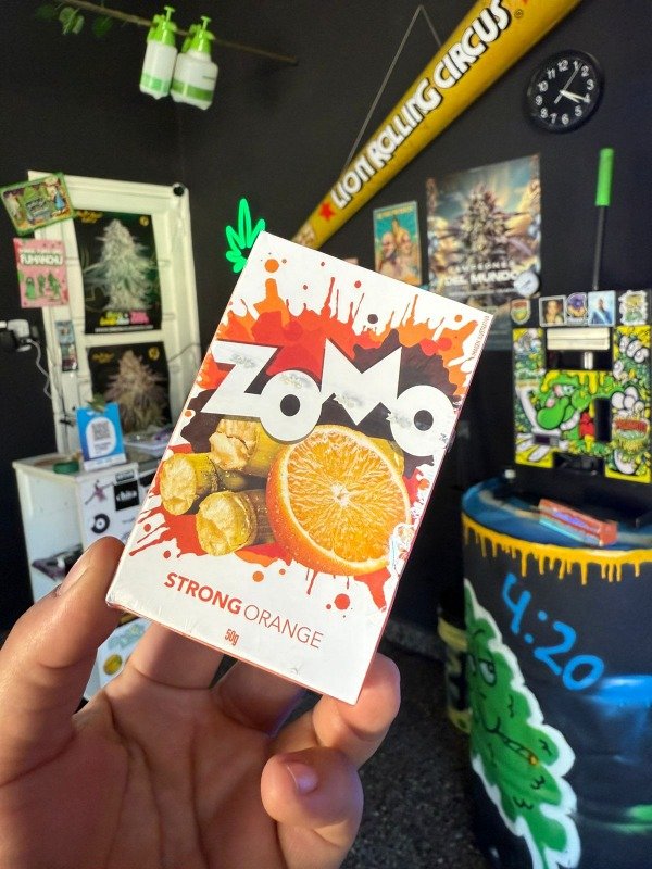 Producto - ZOMO TABACO HUMEDO PARA NARGUILE - SABOR STRONGE ORANGE