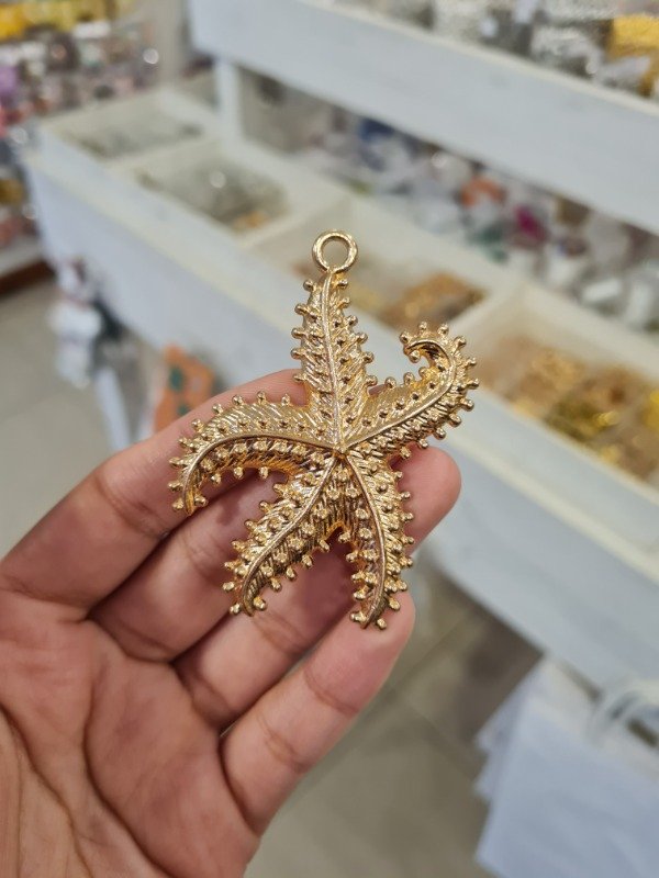 Producto - DIJE DORADO ESTRELLA DE MAR