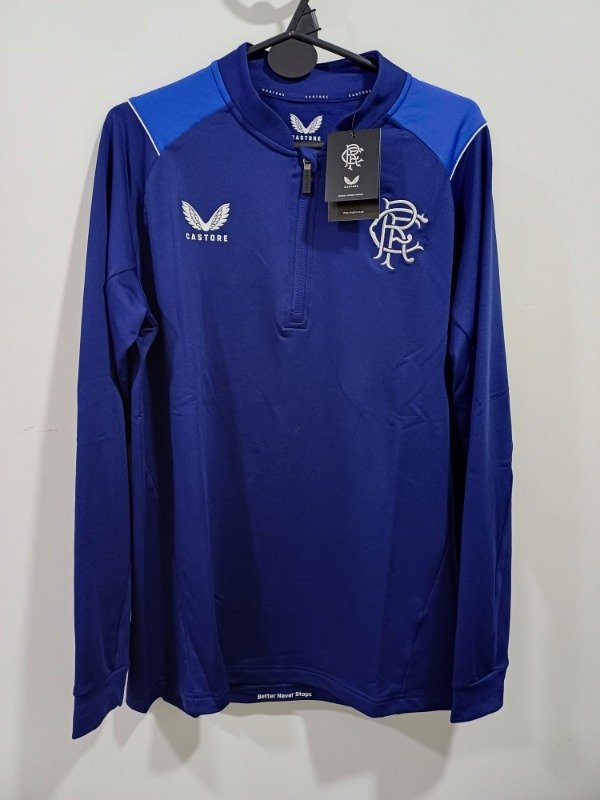 Producto - Buzo medio cierre Rangers - Castore