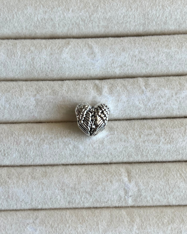 Producto - Dije charm corazon alado de acero blanco 9mm