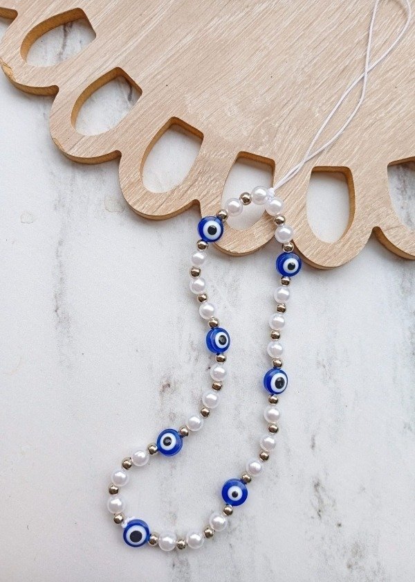 Producto - Strap para el celu ojitos y perlas