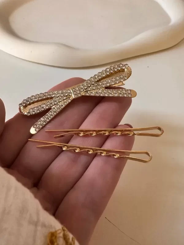 Producto - Pack invisibles y broche strass acero dorado