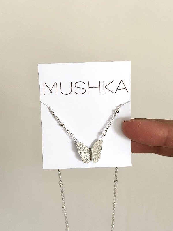 Producto - Cadena de bolitas con mariposa