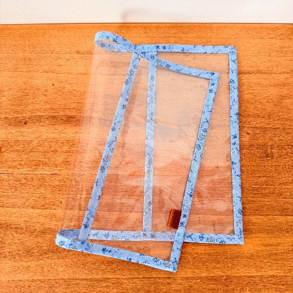 Producto - FUNDA para CUADERNO con tapa de 16,5cm x 21,5cm DIBUJOS en CELESTE