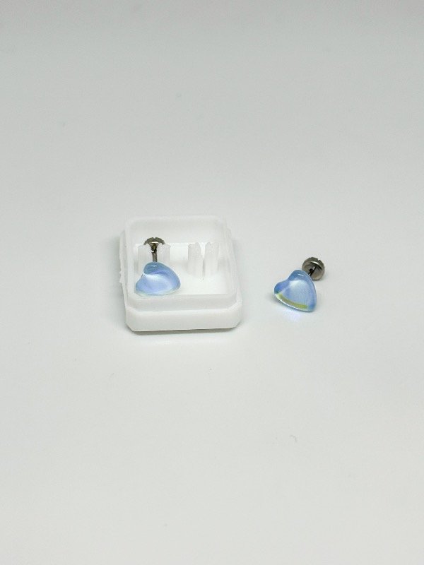 Producto - Abridor acero quirúrgico corazón celeste