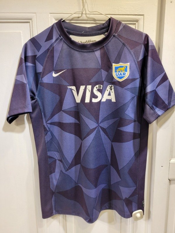 Producto - Remera NIKE azul UAR Talle 18 años - PRECIO: 20X
