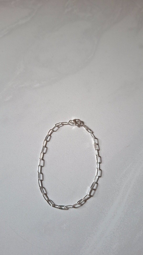 Producto - Pulsera de acero blanco eslabon paper clip oval finito