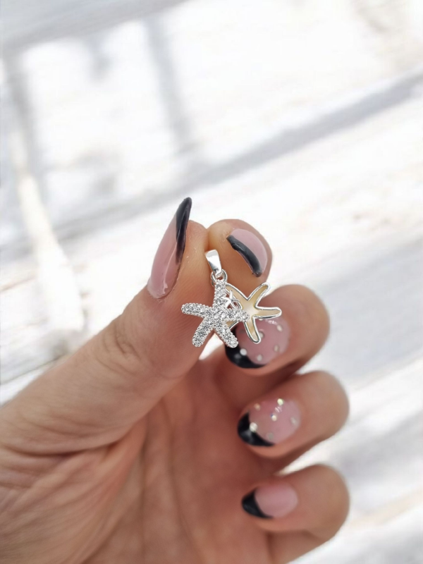 Producto - Dije acero blanco estrella de mar doble strass y nacar
