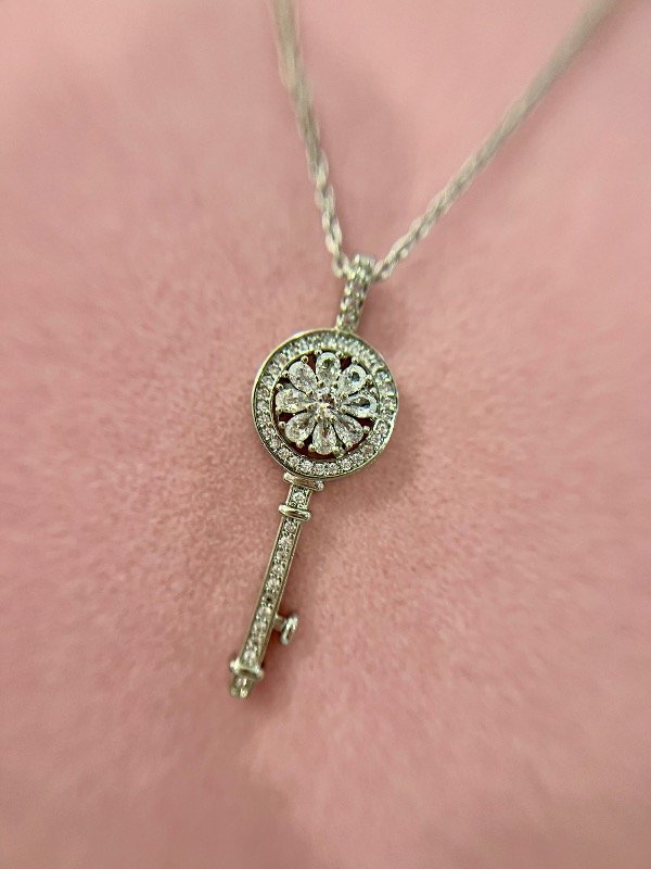 Producto - CADENA CON DIJE GIRATORIO LLAVE ACERO