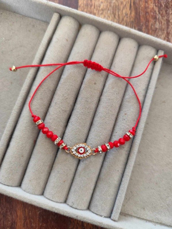 Producto - Pulsera hilo ojito rojo.