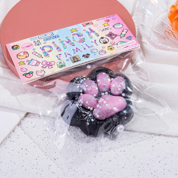 Producto - Taba Squishy Negro y Rosa